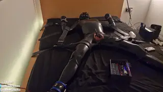 European Stud Endures Electro Bondage in Latex Harness