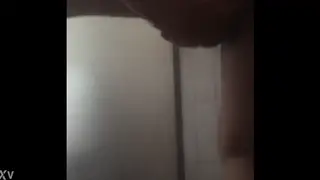 Wet Handjob Builds to a Messy Release Under the Spray