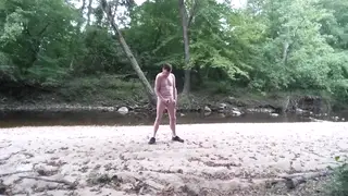 Muscular Daddy Strokes Load Outdoors by Stream