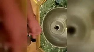 Interracial Encounter Leads to Public Bathroom Blowjob and Release