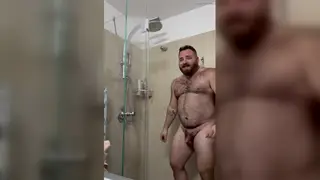 Hairy Bear Strokes Himself Under Steamy Shower