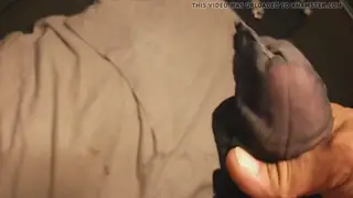 Muscular Stud Strokes Through Sheer Nylon to Explosion