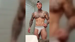 Muscular Tattooed Hunk Strokes to a Facial Finish
