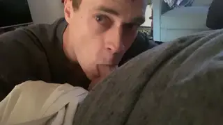 Relaxed Blowjob Session Unfolds in Casual Lounging Setting