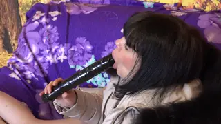 Brunette MILF Sucks a Large Dildo in a Fur-Trimmed Coat