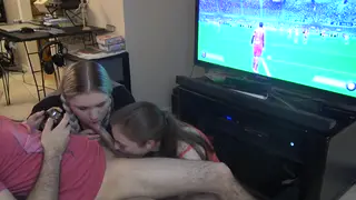 Two Women Share a Guy During a Gaming Session