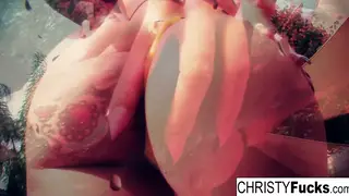 Busty Brunette Pleasures Herself Under the Spray