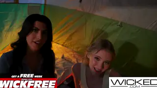 Blonde and Brunette Lesbians Share a Dildo During Camping Threesome