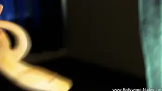 Indian MILF Teases in a Slow Striptease