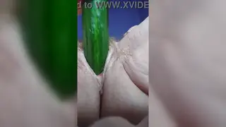 Mature Woman Pleasures Hairy Pussy With a Cucumber