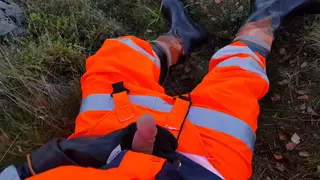 Hi-Vis Worker in Rubber Boots Strokes Massive Cock to Climax