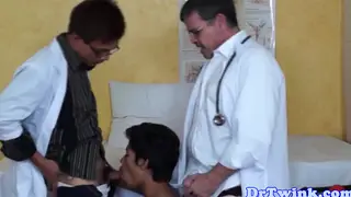 Asian Doctor Twink Services Two Patients in Clinic