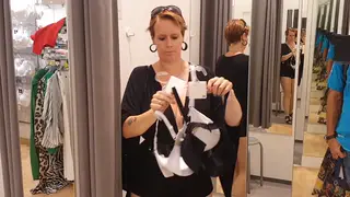 Curvy Blonde Shows Lingerie During a Store Fitting