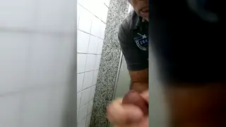 Mature Man Gives Blowjob in Public Restroom