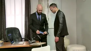 Latino Employee Services Boss at Office Desk
