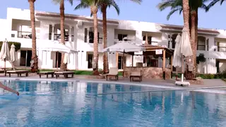 Mature MILF Flashes Shaved Pussy by Pool