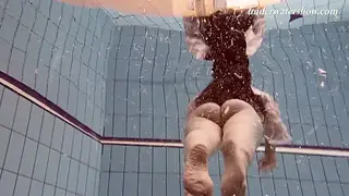 Redhead Teen Strips Solo in Outdoor Pool