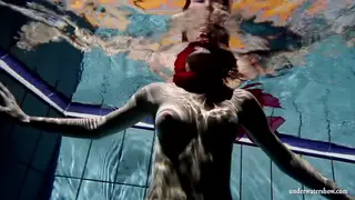 Redhead Teen Strips Lingerie for a Sensual Pool Dip