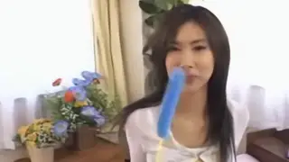 Asian Beauty Explores Pleasure with a Sleek Toy