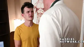 Older Man Examines Young Patient in Clinical Setting