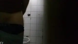 Two Guys Trade Oral Pleasure in a Bathroom