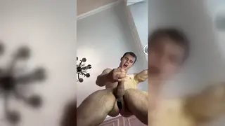 Muscular Jock Strokes His Uncut Cock With a Toy