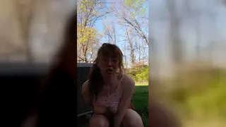 Redhead Explores Her Curves With Toys in the Garden