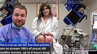 Brunette in Medical Uniform Edges Patient With Wand