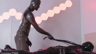 Twink in Latex Endures Bondage and Spanking
