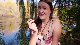 Brunette MILF Smokes Topless in a Public Park