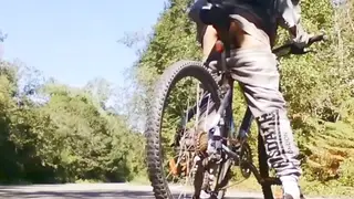 Ebony Hunk Rides Bike Outdoors With Plug Inserted