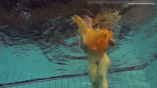 Blonde Teen Swims Nude in a Pool and at the Beach