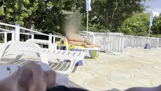 Busty Woman Strokes Man to Climax Beside Public Pool