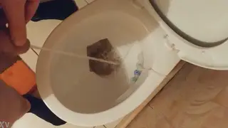 Guy Lets Loose a Golden Stream Over the Bowl