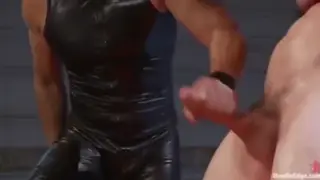 Bound Muscle Hunk Takes Rough Handjob to Explosive Finish