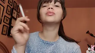 Brunette Latina Teases with Glossy Lips and Smoke