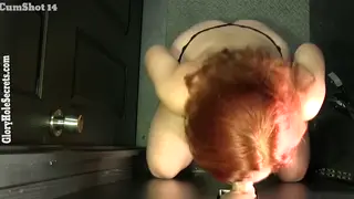 Redhead Mature Swallows Strangers' Loads at Gloryhole