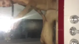 Petite Teen Strokes Her Boyfriend in a Steamy Bathroom Encounter