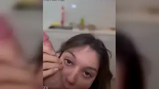 Amateur Holds Up Paper for Camera Check