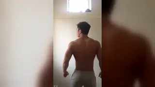 Asian Coach Flexes and Strokes in Gym Solo
