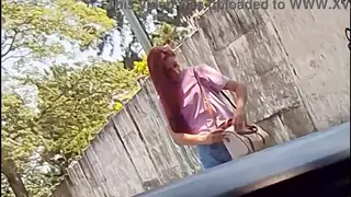 Redhead Delivers a Steamy Handjob in a Parked Car