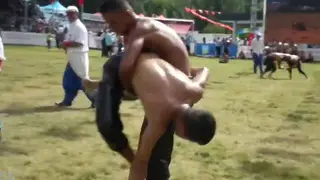 Oil-Slicked Middle Eastern Men Wrestle in Public Gym