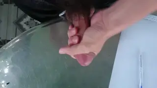Asian Solo Guy Strokes His Cock on a Table