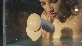 Curvy Woman in Latex Lingerie Endures Water Bondage with Toys