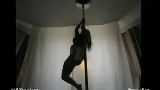 Redhead Teases in Lingerie During Steamy Pole Dance