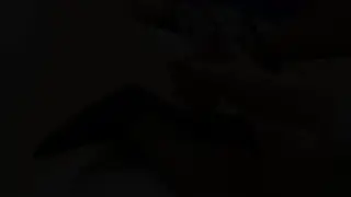 Ebony Woman in Black Stockings Gives a Footjob on the Couch