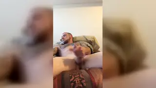 Tattooed Guy Works His Cock With a Slow Handjob