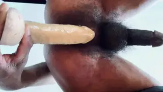 Ebony Hunk Gapes Wide With a Massive Toy on a Chair