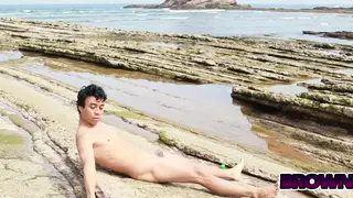Oil Drips Over Naked Bodies on a Public Beach