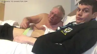Hairy Bear Gives Handjob to Slim Teen at Desk